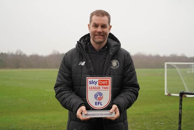 Harrogate Town chief Simon Weaver, with his League Two manager of the month award for January. Picture courtesy of Sky Bet.
