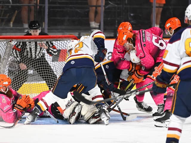 COMMITTED TO THE CAUSE: Sheffield Steelers battle to keep Guildford from clawing a goal back on Wednesday night, the 3-0 win for the hosts maintaining their 14-point lead at the top of the Elite League table. Picture: Dean Woolley.