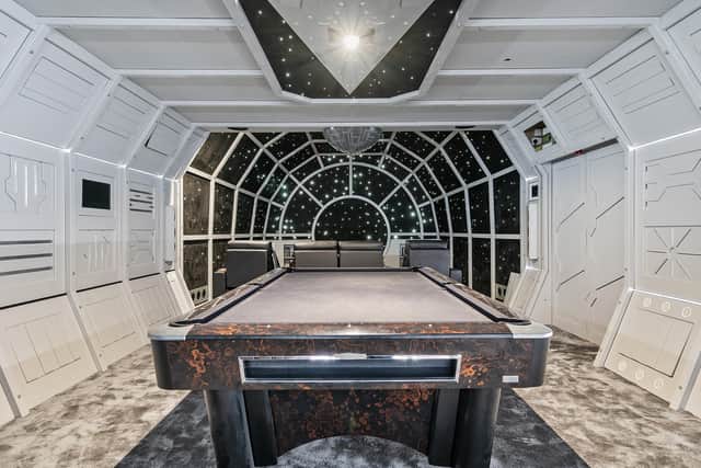The cinema/pool room has been created as a replica of the cockpit of the Millenium Falcon from Star Wars