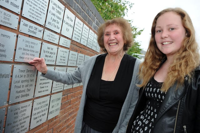 On 2015 Irma Denton and her grandaughter, Lydia Denton, take a look at the memorial wall, where a plaque for her husband, Trevor is situated