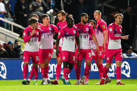 Huddersfield Town's Josh Ruffels (second left) celebrates scoring their side's first goal of the game during the Sky Bet Championship match at Loftus Road, London. Picture: Zac Goodwin/PA Wire.