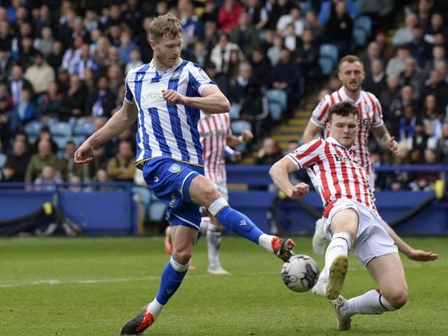 Sheffield Wednesday's Michael Smith is challenged by Stoke City's Michael Rose in last weekend's game at Hillsborough. Picture: Steve Ellis.