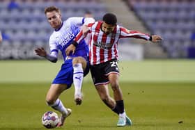 HIGH ON CONFIDENCE: Sheffield United forward Iliman Ndiaye (right) battles for possession with Wigan Athletic's Tom Naylor