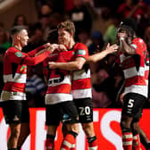 Doncaster Rovers’ Joe Ironside (second right) celebrates scoring the opening goal with his team mates during the Carabao Cup second round match at the Eco-Power Stadium, Doncaster. Picture date: Wednesday August 30, 2023. PA Photo. See PA story SOCCER Doncaster. Photo credit should read: Mike Egerton/PA Wire.

RESTRICTIONS: EDITORIAL USE ONLY No use with unauthorised audio, video, data, fixture lists, club/league logos or "live" services. Online in-match use limited to 120 images, no video emulation. No use in betting, games or single club/league/player publications.