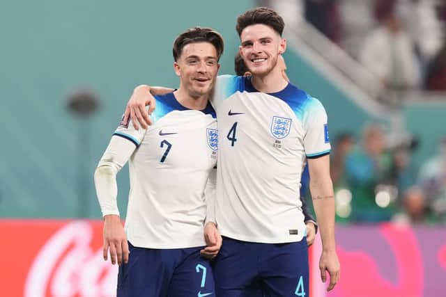 England's Jack Grealish (left) celebrates with team-mate Declan Rice after the thrashing of Iran (Picture: Martin Rickett/PA Wire)