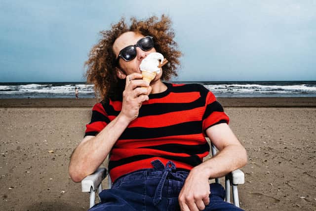 Luke Brennan wears RAKER Coooper Knitted Tee in Red and Navy, £60, photographed by Tom Atkin.