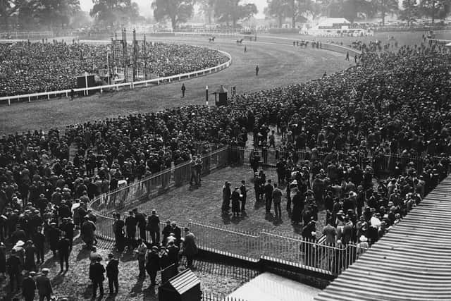 Crowds at Doncaster race-course on busy race day. (Pic credit: Topical Press Agency / Getty Images)