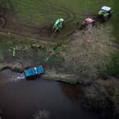 The recovered vehicle being removed from the River Esk near Glaisdale, North Yorkshire