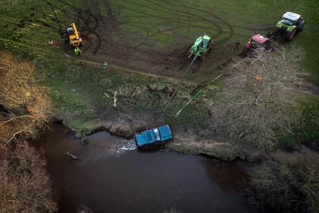 The recovered vehicle being removed from the River Esk near Glaisdale, North Yorkshire