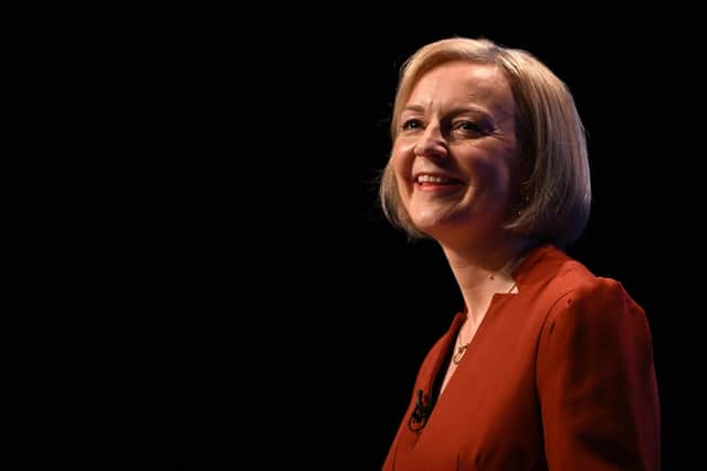 Britain's Prime Minister Liz Truss reacts as she arries to deliver her keynote address on the final day of the annual Conservative Party Conference in Birmingham, central England, on October 5, 2022. (Photo by Paul ELLIS / AFP) (Photo by PAUL ELLIS/AFP via Getty Images)