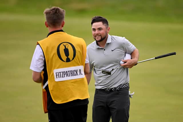 Alex Fitzpatrick of England shakes hands with his caddie on the 18th green after shooting a 65 on day three of the Open (Picture: Ross Kinnaird/Getty Images)