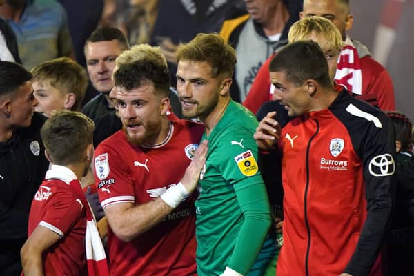 Barnsley's Nicky Cadden and goalkeeper Harvey Isted celebrate getting to the play-off final (Picture: Tim Goode/PA Wire)