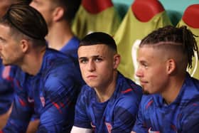 AL KHOR, QATAR - NOVEMBER 25: Phil Foden of England looks on from the bench during the FIFA World Cup Qatar 2022 Group B match between England and USA at Al Bayt Stadium on November 25, 2022 in Al Khor, Qatar. (Photo by Ryan Pierse/Getty Images)