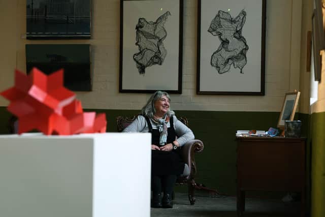 Sunny Bank Mills Art Gallery director Jane Kay with the latest exhibition Woven Stories, which is her final one before leaving after having been in post for ten years. Picture Jonathan Gawthorpe