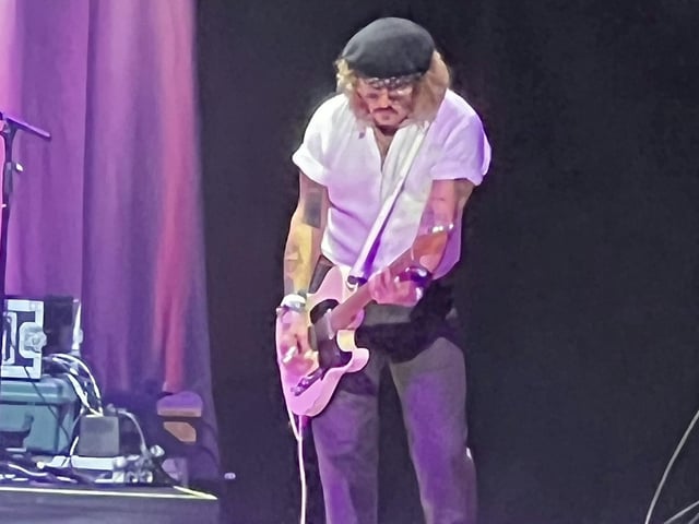 Hollywood star Johnny Depp stunned fans when he flew to from his libel trial to perform on stage with pop star Jeff Beck during a gig in Sheffield. Depp flew straight from Virginia in the US to join his music collaborator Jeff Beck on his European tour. May 29 2022. See SWNS story SWLEdepp.