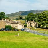 Looking north across Bainbridge's expansive rectangular village green, bisected the main east-west route through the Yorkshire Dales.
