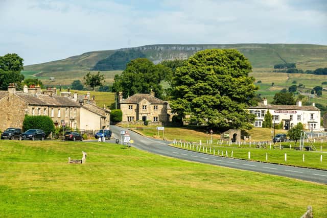 Looking north across Bainbridge's expansive rectangular village green, bisected the main east-west route through the Yorkshire Dales.