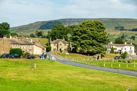 Looking north across Bainbridge's expansive rectangular village green, bisected the main east-west route through the Yorkshire Dales.