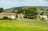 Looking north across Bainbridge's expansive rectangular village green, bisected the main east-west route through the Yorkshire Dales.