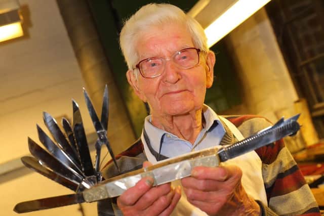 Pictures supplied by the Stan Shaw family of Stan Shaw at his workshop at Kelham Island Museum, Sheffield. Stan, was the last cutler or 'little mester', who made knives for the Queen and carried the cutler's tradition until his death in 2021 after 80 years forging, grinding and finishing blades. Picture By Yorkshire Post Photographer,  James Hardisty.