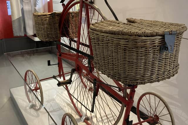 A four-wheeled 19th Century postal delivery bike on display in Ironbridge