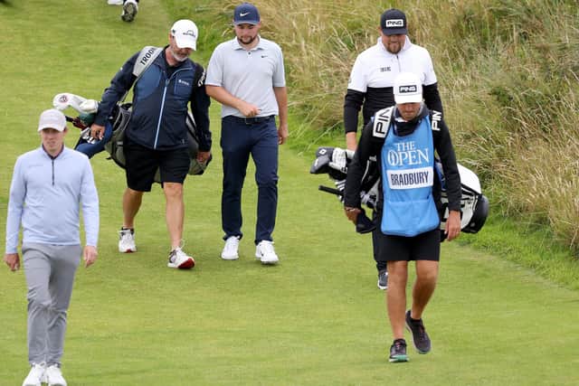 Team Yorkshire: Sheffield brothers Alex Fitzpatrick, centre, Matt Fitzpatrick, left, and Dan Bradbury of Wakefield, right, walk on the 13th hole during a practice round prior to The 151st Open at Royal Liverpool on Tuesday (Picture: Warren Little/Getty Images)