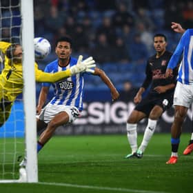 Huddersfield Town's Ilias Bronkhorst scores the hosts' opening goal against Peterborough United. Picture: Jonathan Gawthorpe
