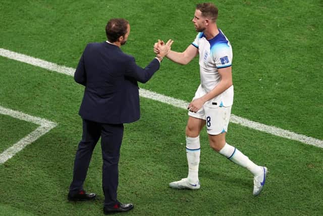 AL KHOR, QATAR - DECEMBER 04: Gareth Southgate, Head Coach of England, shakes hands with Jordan Henderson after a substitution during the FIFA World Cup Qatar 2022 Round of 16 match between England and Senegal at Al Bayt Stadium on December 04, 2022 in Al Khor, Qatar. (Photo by Alexander Hassenstein/Getty Images)