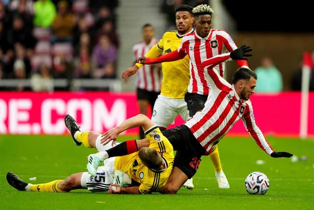 FOUL: Jaka Bijol (left) brings down Enzo Le Fee (Image: Owen Humphreys)
