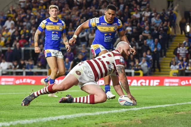 Jake Bibby scores a try against Leeds Rhinos. (Photo: Dean Williams)