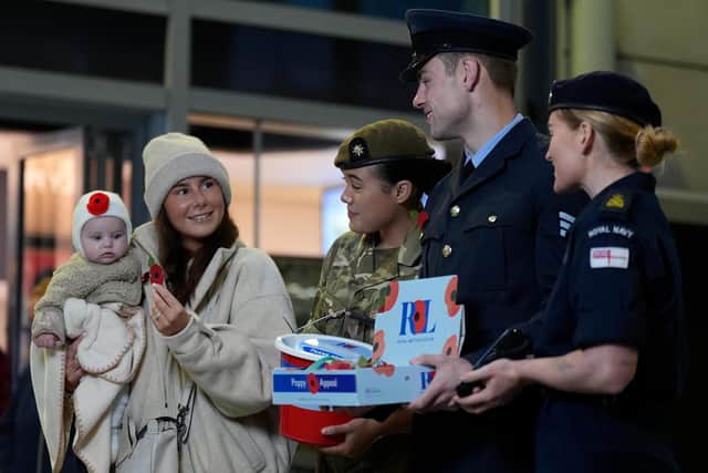 Five-month-old Florence Furness and her mother Ashton Furness with poppy sellers, during the Royal British Legion Poppy Appeal 2026 national launch at Manchester Victoria Station. Picture date: Thursday October 22, 2026.