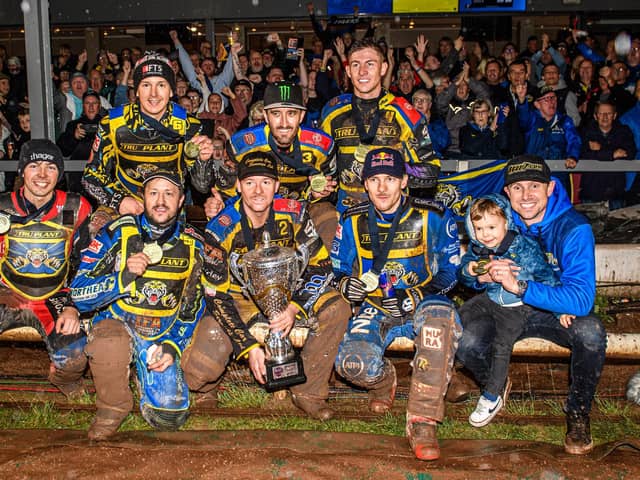 For the fans: Simon Stead, right, with his son on his lap and his Sheffield Tigers team to his right as they celebrate with their Premiership Trophy in front of their fans after winning the Sports Insure Premiership Grand Final (Picture: Ian Charles/MI News)