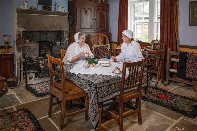 Volunteers Anne Hodge and Linda Eastwood in Mrs Pearson's living room, at The Colne Valley Museum in Golcar near Huddersfield, photographed for The Yorkshire Post by Tony Johnson