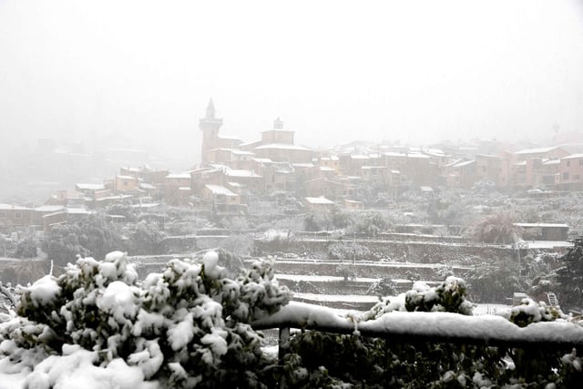 Towns across the Balearic island of Mallorca, including Valldemossa and Lluc, were blanketed in snow and temperatures dropped to minus two degrees Celsius (Photo by JAIME REINA/AFP via Getty Images)
