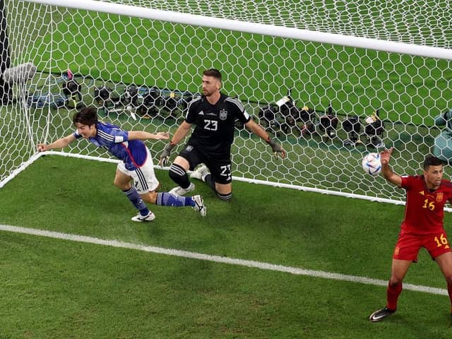 HIGH POINT:  Ao Tanaka wheels away after scoring Japan's controversial second goal in their 201 win World Cup over Spain in Doha
