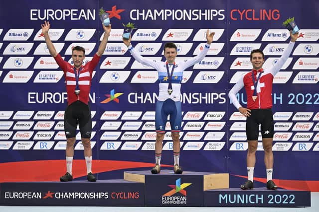 British Tom Pidcock of Ineos Grenadiers celebrates on the podium after winning the men cross country race of the Mountainbike (VTT) event on the ninth day of the Athletics European Championships, at Munich 2022, Germany, on Friday 19 August 2022. The second edition of the European Championships takes place from 11 to 22 August and features nine sports. BELGA PHOTO ERIC LALMAND (Photo by ERIC LALMAND / BELGA MAG / Belga via AFP) (Photo by ERIC LALMAND/BELGA MAG/AFP via Getty Images)