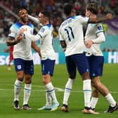 Left to right, England's Callum Wilson, Phil Foden and Marcus Rashford celebrate after Jack Grealish (right) scores their side's sixth goal of the game during the FIFA World Cup Group B match at the Khalifa International Stadium in Doha (Picture: Martin Rickett/PA)