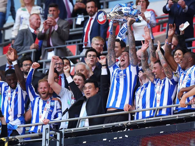ON THE UP: Sheffield Wednesday chairman Dejphon Chansiri celebrates with his players and the League One play-off final trophy after seeing his team defeat Barnsley at Wembley Stadium to secure promotion back to the Championship  Picture: Richard Heathcote/Getty Images.