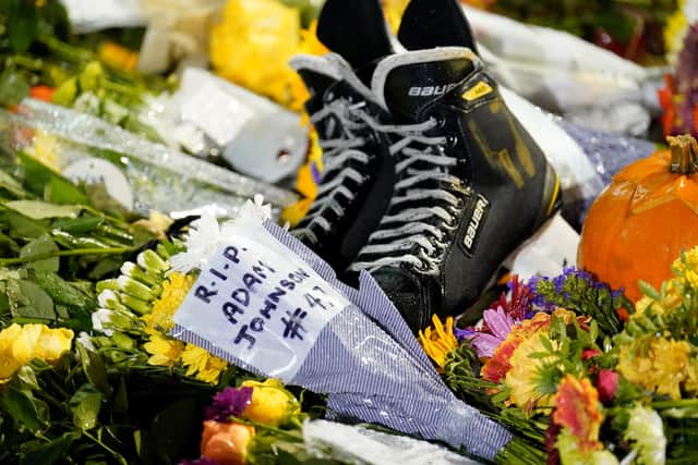 Floral tributes outside the Motorpoint Arena, Nottingham, ahead of a memorial for Nottingham Panthers' ice hockey player Adam Johnson. Zac Goodwin/PA Wire.