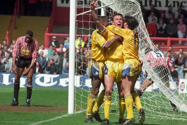 BLADES BLUNTED: Jon Newsome, arm aloft, celebrates the most famous goal of his career, for Leeds United at Sheffield United in 1992