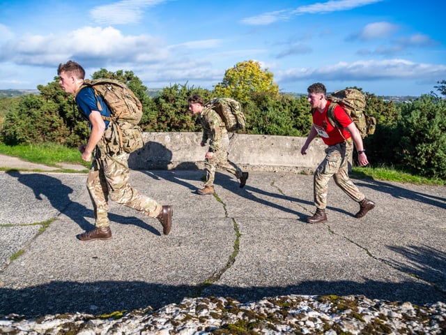 Competitors faced a demanding 10-mile test of physical fitness and stamina while carrying 18kg of load-bearing equipment.
