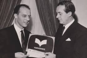 Rex Ripley (left) receiving the prize cheque of £370 for his logo design from Yorkshire TV managing director Ward Thomas in 1968