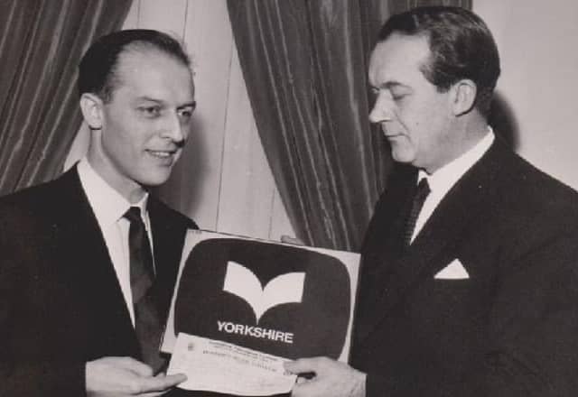 Rex Ripley (left) receiving the prize cheque of £370 for his logo design from Yorkshire TV managing director Ward Thomas in 1968
