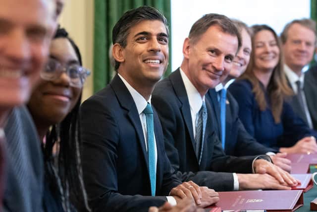 Britain's Prime Minister Rishi Sunak with various colleagues. Photo by STEFAN ROUSSEAU/POOL/AFP via Getty Images.