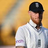 Putting a brave face on it. England captain Ben Stokes leave the field with his side already facing a mountain to climb almost as big as the overlooking Himalayas. Photo by Gareth Copley/Getty Images.
