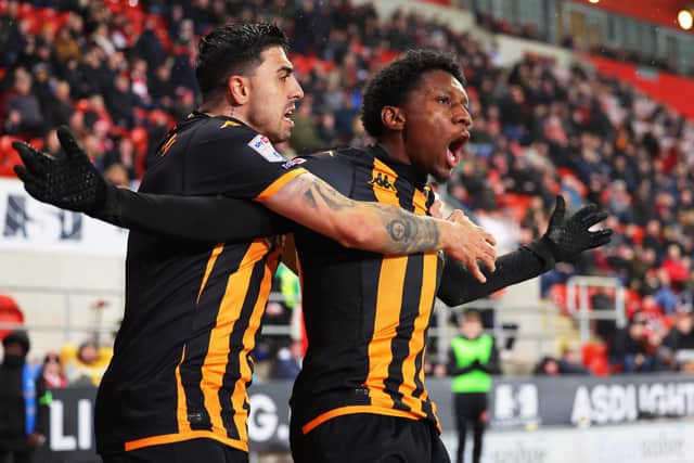 SHOCK AND AWE: Jaden Philogene celebrates his outstanding goal with Hull City team-mate Ozan Tufan
