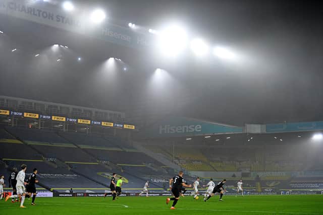 The floodlights blare out at Elland Road (Picture: OLI SCARFF/POOL/AFP via Getty Images)