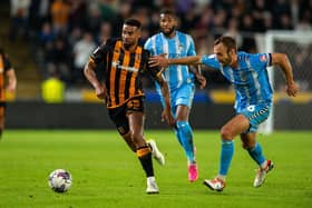 Hull City's Cyrus Christie is chased down by Liam Kelly of Coventry City. (Picture: Bruce Rollinson)