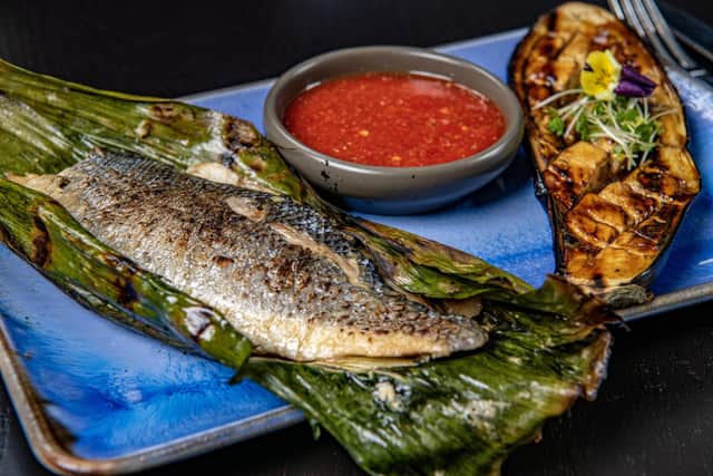 Pla Yang - grilled Sea bass fillets with sautéed aubergine and a chilli and lime dressing.