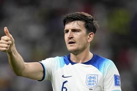 TOP MAN: England's Harry Maguire shows his appreciation to team-mate John Stones during the Group B soccer match against Iran Picture: AP Photo/Abbie Parr
